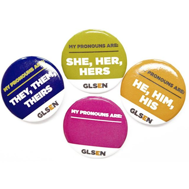On a white background are four GLSEN pronoun pins. From left to right, the purple one reads: my pronouns are they, them, theirs; the lime one reads: my pronouns are she, her, hers; the gold one reads: my pronouns are he, him, his; and the blank magenta one reads: my pronouns are. 