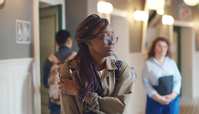 Student standing in the hallway