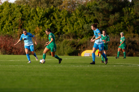 A group of students playing soccer.