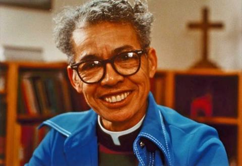 Pauli Murray smiling and wearing a blue shirt.